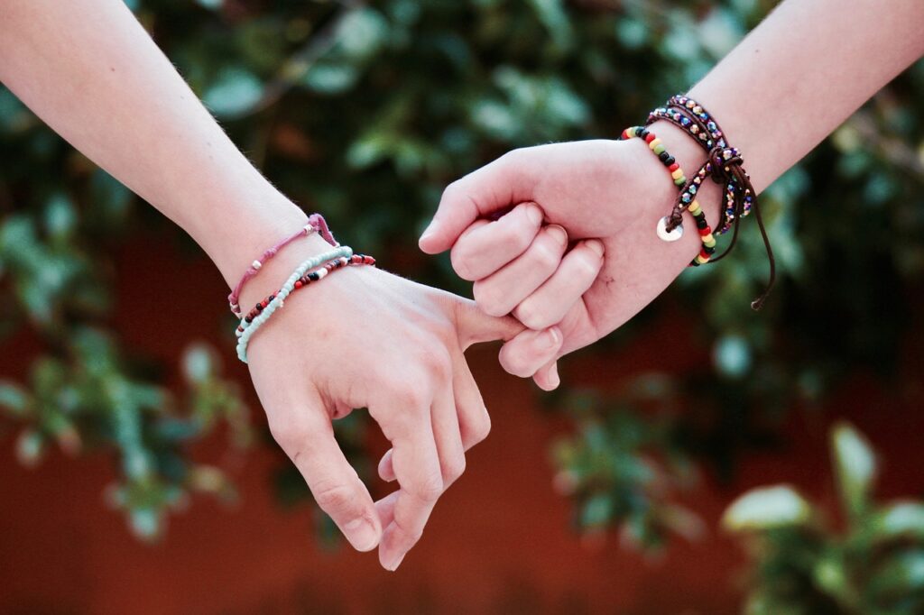 hands wearing Bracelets